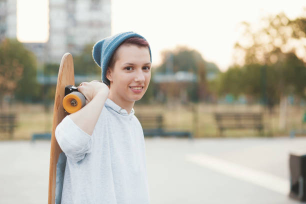 istock Young woman with skateboard 832133718