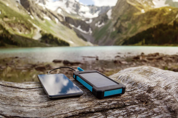 battery solar energy device on the background of beautiful mountain scenery. - russia river landscape mountain range imagens e fotografias de stock