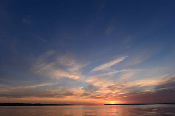 istock Glow of the sunset in a clear summer blue sky 832138134
