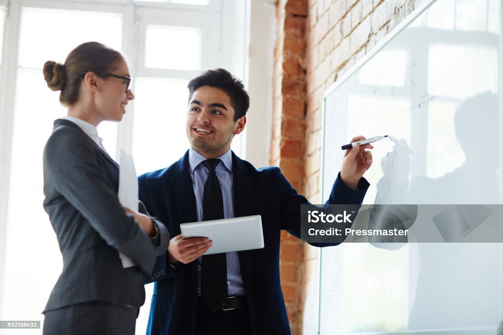 Person Explaining Data Explaining Data On Whiteboard Stock Photo - Download Image Now ...