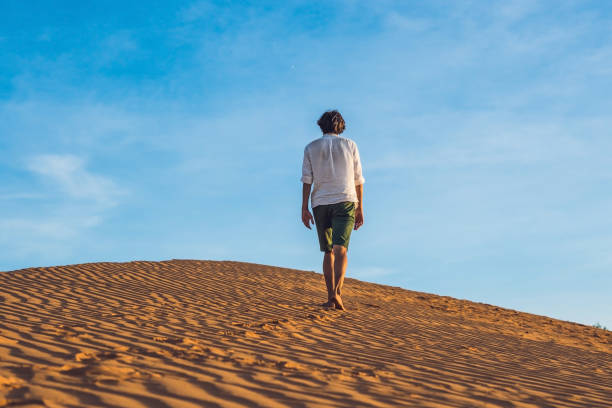 istock A man lost in the red desert in Vietnam, Mui Ne 832142148