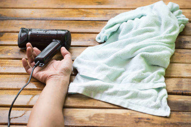 istock Hair dryer electric shock and wet hand 832143592