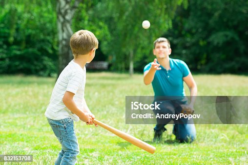 istock Boy Playing Baseball With His Father 832153708