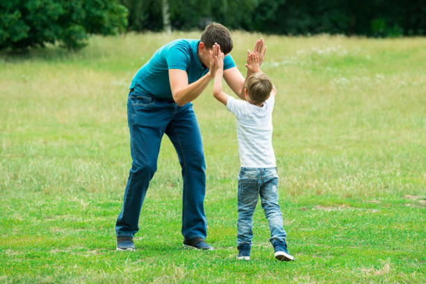 istock Boy Giving High Five To His Father 832153714