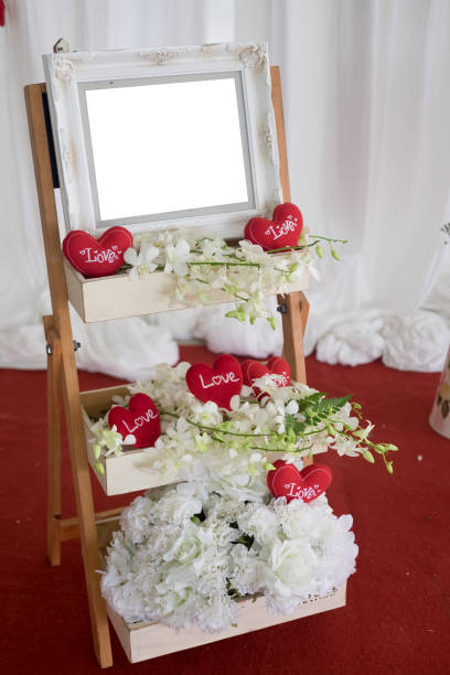 istock Blank frame and flower on shelf table in wedding day 832155206