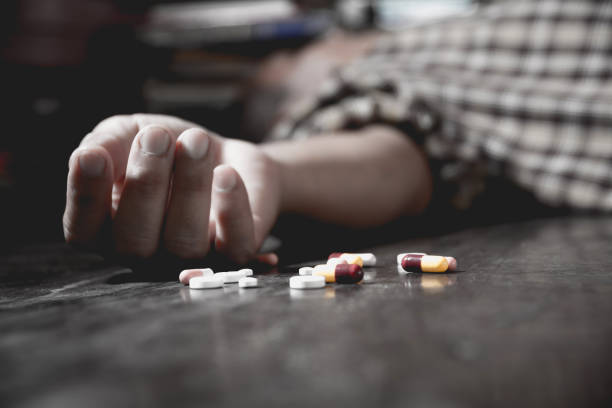 Close up of overdose pills and addict. Close up of overdose pills and addict. drug overdose stock pictures, royalty-free photos & images