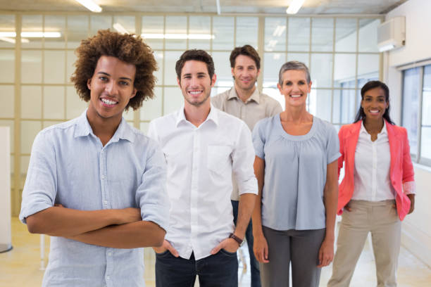 istock Group of workers smiling at the camera 832162958
