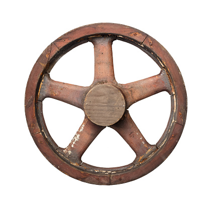 Isolated objects: one very old wooden waggon wheel on white background