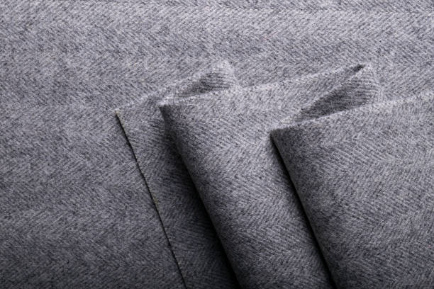 tweedstoff, wolle grau fischgrat textile hintergrund. - cashmere texture stock-fotos und bilder