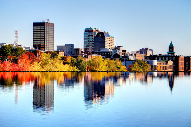 Autumn in Manchester, New Hampshire Manchester New Hampshire skyline along the banks of the Merrimack River in autumn. Manchester is the largest city in the state of New Hampshire and the largest city in northern New England. Manchester is known for its industrial heritage, riverside mills, affordability, and arts & cultural destination. new hampshire stock pictures, royalty-free photos & images