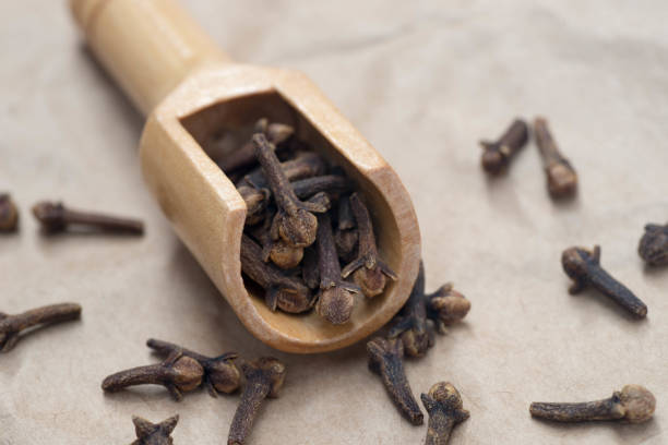 istock dried spice cloves  in measuring spoon 832178350