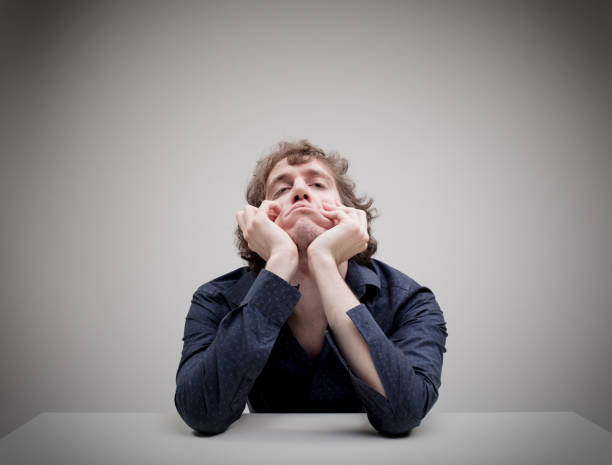 istock portrait of young bored man thinking 832178358