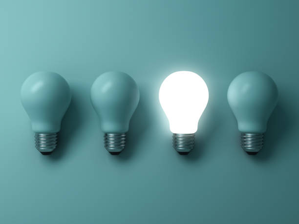 istock One glowing light bulb standing out from the unlit incandescent bulbs on green background with reflection , individuality and different creative idea concepts . 3D rendering 832186822