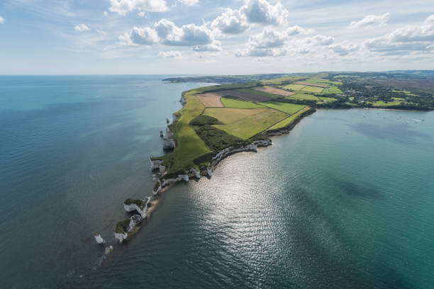 Aerial View of Old Harry Rocks and Purbeck Hills Aerial View of Old Harry Rocks and Purbeck Hills and Dorset coastline on a sunny day. old harry rocks stock pictures, royalty-free photos & images