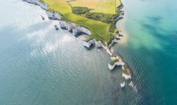 Aerial View of Old Harry Rocks and Purbeck Hills and Dorset coastline on a sunny day.