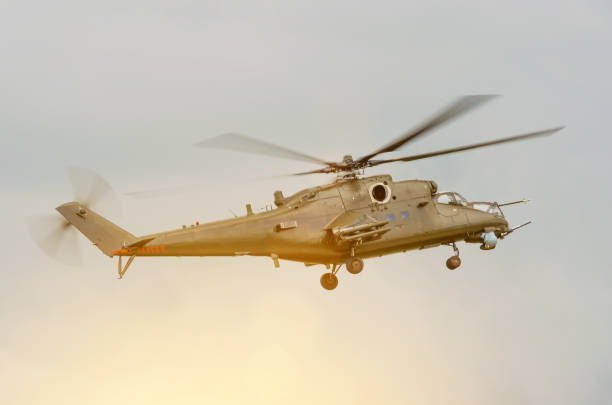 istock Military helicopter with weapons in the sky 832203070