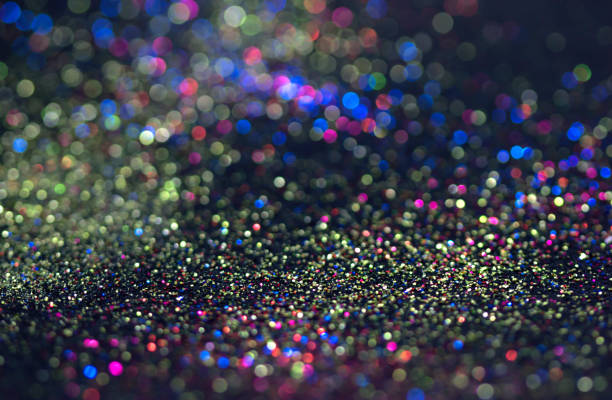 istock Bokeh glitter fly and lights on black 832203692