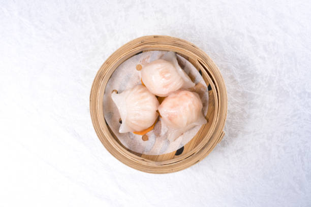 Baozi chinese dumplings on bamboo steamer Baozi chinese dumplings on bamboo steamer cantonese cuisine stock pictures, royalty-free photos & images