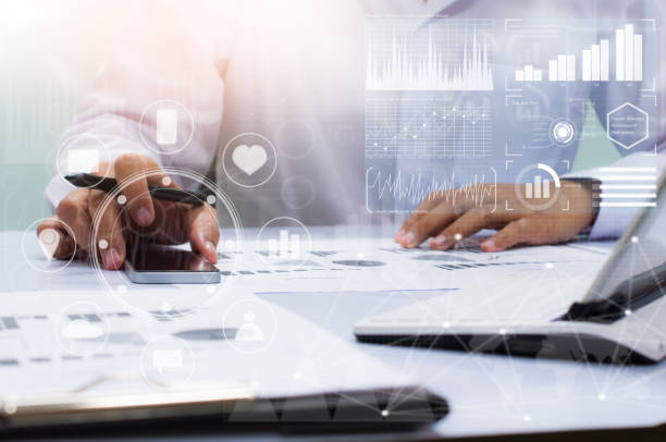 istock businessman working with business documents on office table with digital tablet computer and graph finance diagram in the background 832204758