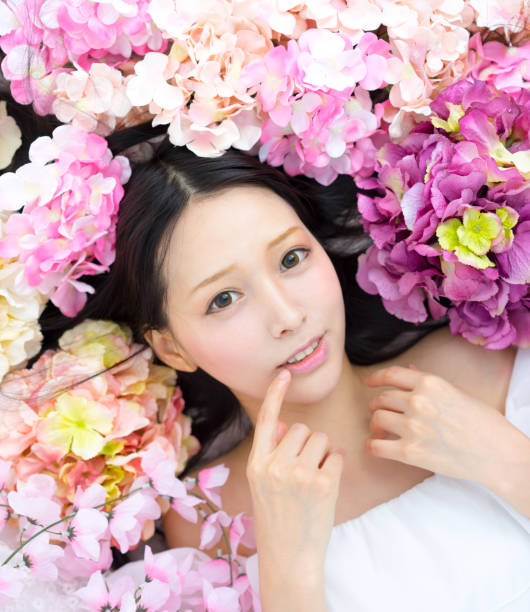 istock girl in flowers sleeping spa 832223120