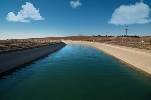 Agricultural irrigation channel Agricultural irrigation channels. Water transportation to arid place kanal stock pictures, royalty-free photos & images
