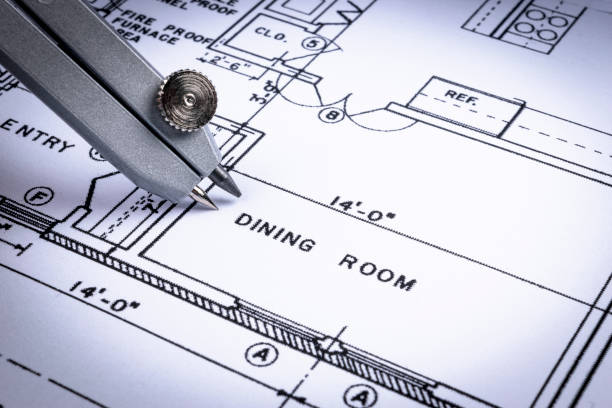 istock Architectural blueprints and blueprint rolls and a drawing instruments on the worktable. Drawing compass, plans. Civil Engineering, Construction background. 832240554