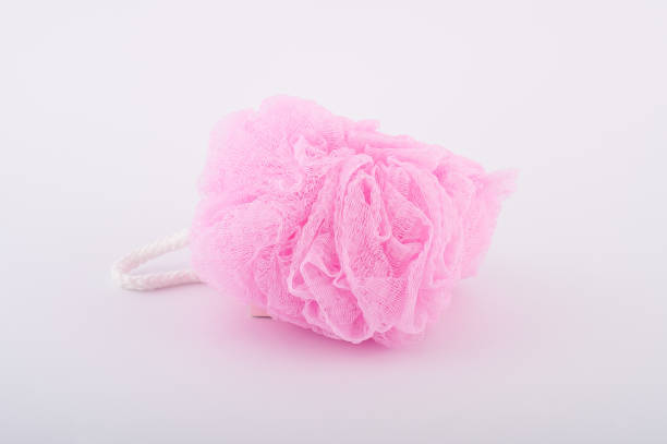 istock Soft pink bath puff or sponge isolated on white background 832243062
