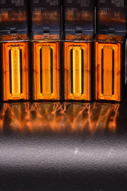 istock Four identical printheads lined up with reflecting nozzles facing camera 832254266