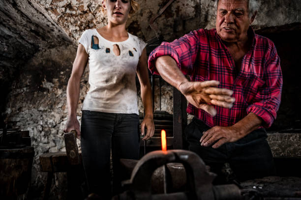 forge lit by coal with red-hot metal inside background