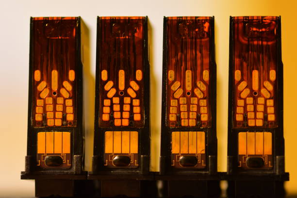 istock Four identical printheads lined up with electrical contacts facing camera 832254914