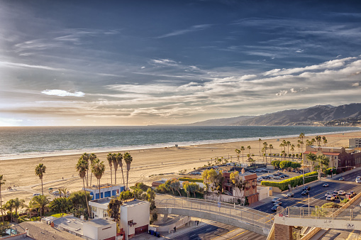 A beautiful view of Santa Monica beach and ocean front homes, and scenic Pacific Coast Highway in Southern California