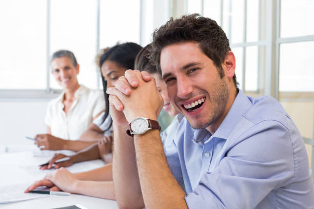 istock Casual businessman laughing during meeting 832258820