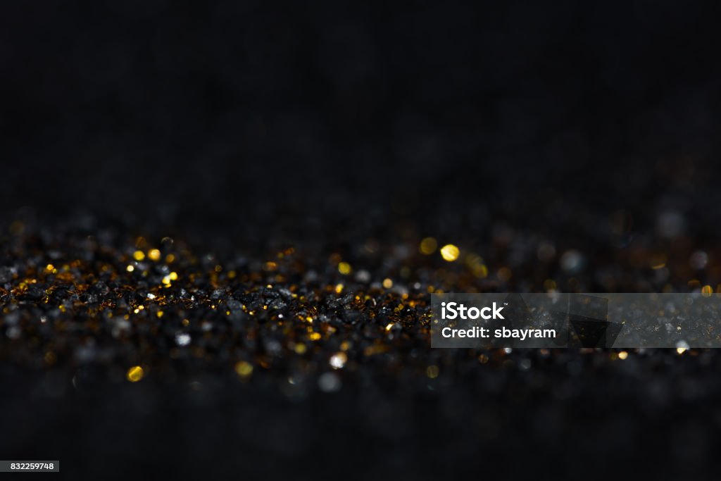 Golden Glitter in Black Diamond - Gemstone Stock Photo