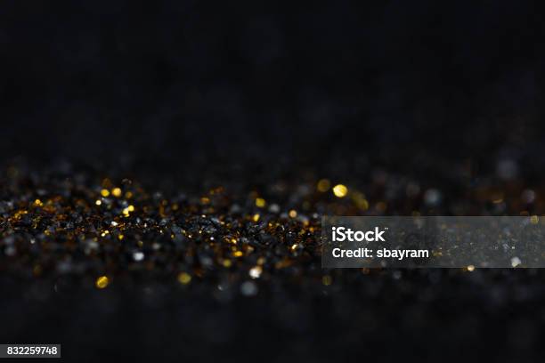 Golden Glitter In Black Stock Photo - Download Image Now - Diamond - Gemstone, Dark, Confetti