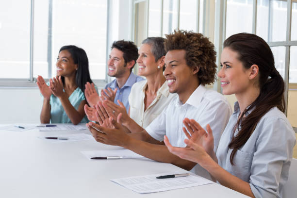 istock Casual business team clapping at presentation 832260302