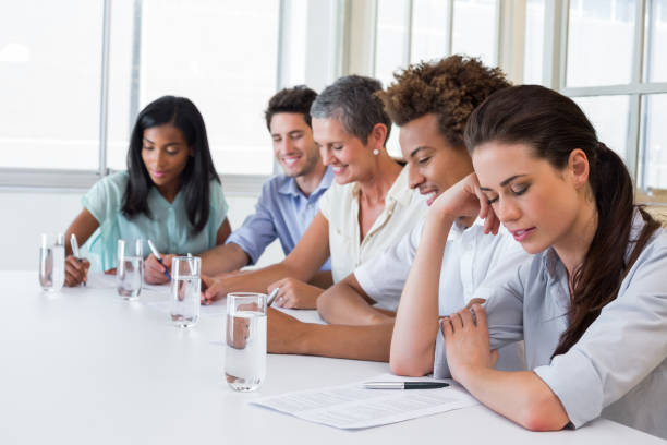 istock Business people writing in notebooks 832260952