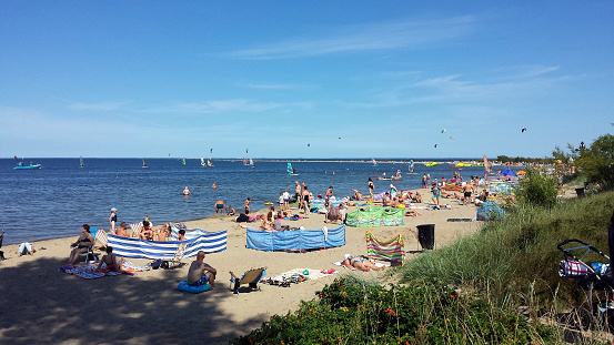 Rewa, Poland - August 15, 2017: People are resting on the beach on a sunny day in Rewa, Poland