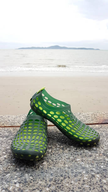 istock hole silicone shoe on the marble floor with beach view 832263742