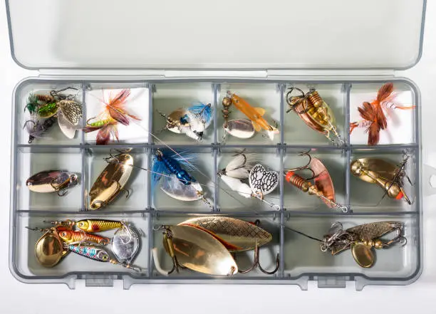 Photo of fishing lures in the box background
