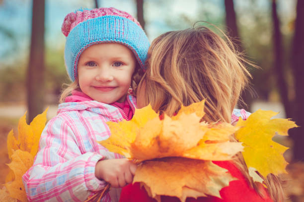istock Mother with child outdoors in autumn 832270094