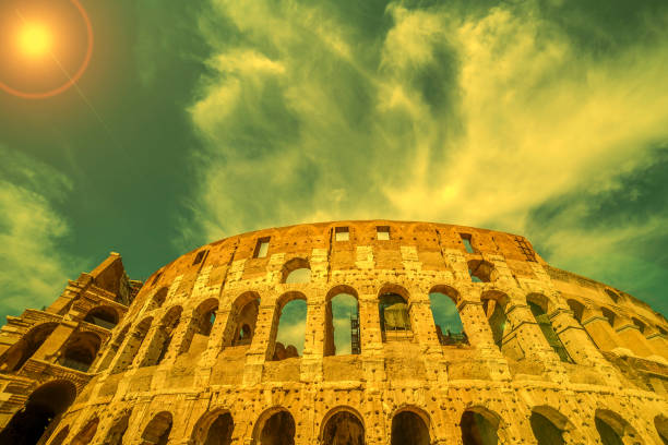 view outside the colosseum, rome, italy in sunset light - roman column arch pedestrian walkway imagens e fotografias de stock