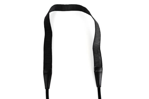 Black camera strap standard design equipment strength support heavy size for professional photographer shoulder sling belt easy shoot photo on white isolated background. Black camera strap standard design equipment strength support heavy size for professional photographer shoulder sling belt easy shoot photo on white isolated background. strap photos stock pictures, royalty-free photos & images
