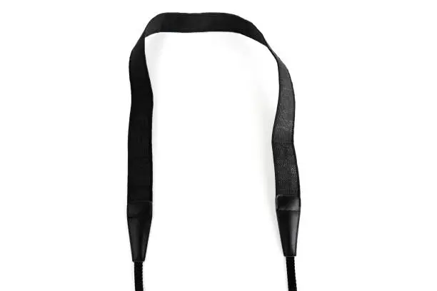 Photo of Black camera strap standard design equipment strength support heavy size for professional photographer shoulder sling belt easy shoot photo on white isolated background.