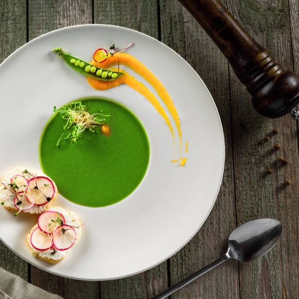 istock Pea cream soup in rim soup plate 832278368