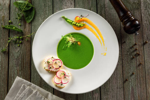istock Pea cream soup in rim soup plate 832279192