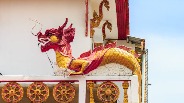 istock dragon statue on temple roof thai 832285064