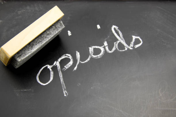 Opioid on blackboard with eraser Opioid written in chalk on blackboaard with eraser. fentanyl addiction stock pictures, royalty-free photos & images