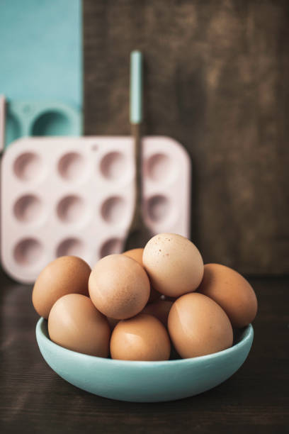 Pastels. Zen in the kitchen. Pastel colored kitchen equipment with eggs Zen in the kitchen. Pastel colored kitchen equipment with eggs muffin tin eggs stock pictures, royalty-free photos & images