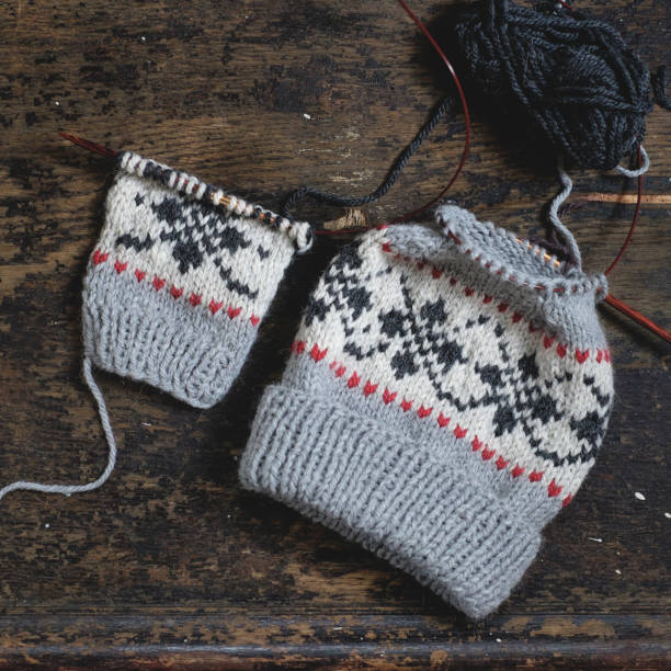 istock Unfinished knitted cap on knitting needles 832344920