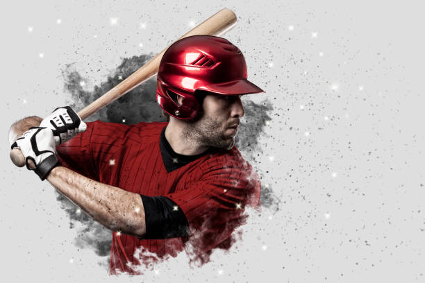 Baseball Player Baseball Player with a red uniform coming out of a blast of smoke . baseball player stock pictures, royalty-free photos & images
